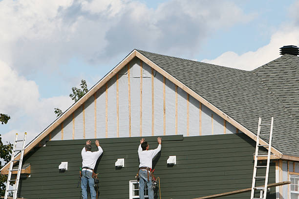 Professional Siding technician working in Hendersonville, NC